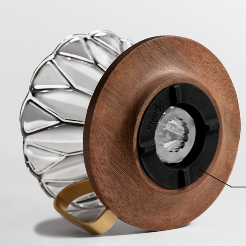LAMOSE zeroHero Walnut Prisma Dripper, close-up side view: wooden base, clear geometric glass, brass handle, black gasket.