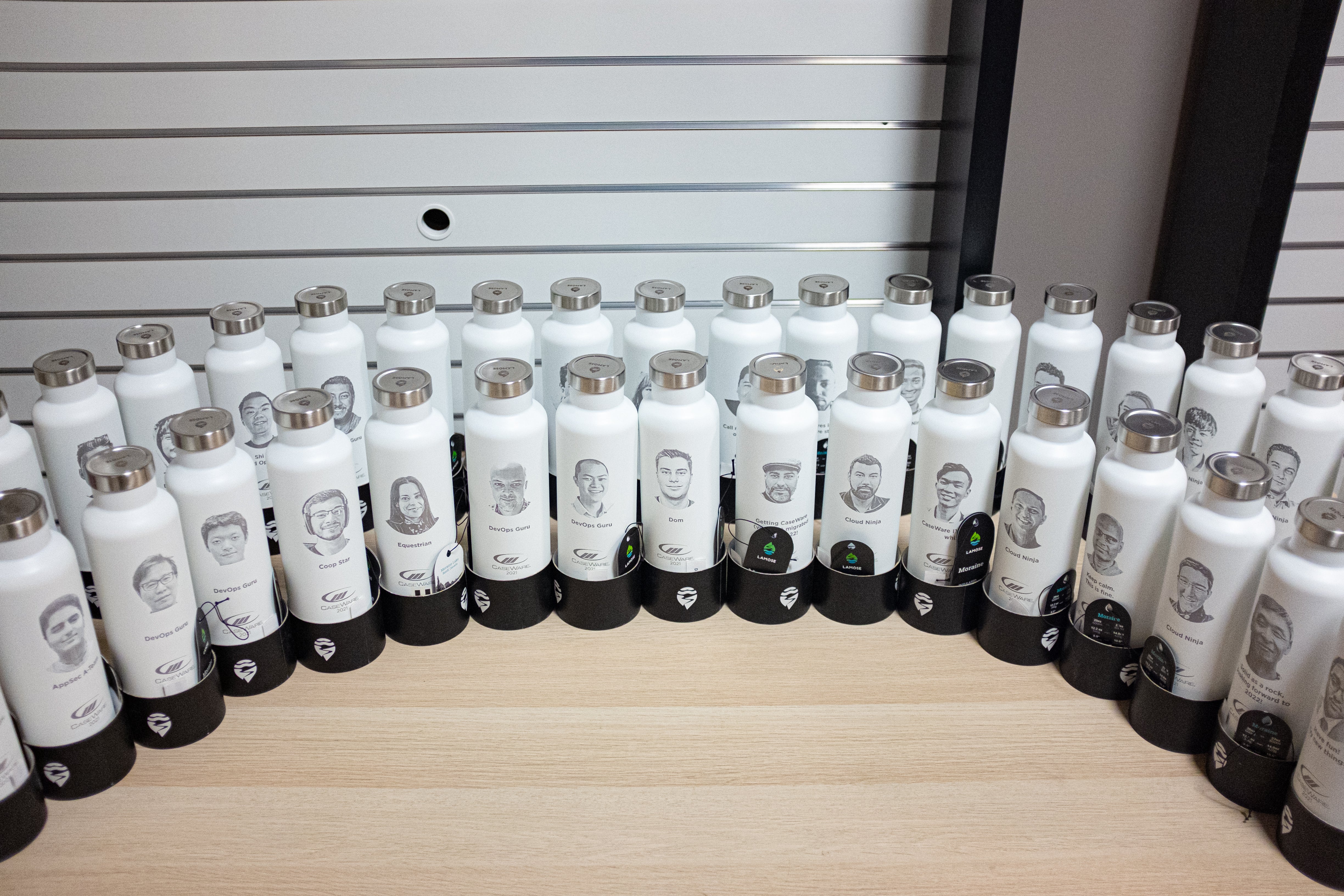 Personalized LAMOSE water bottles with employee photos for tech company holiday gifts