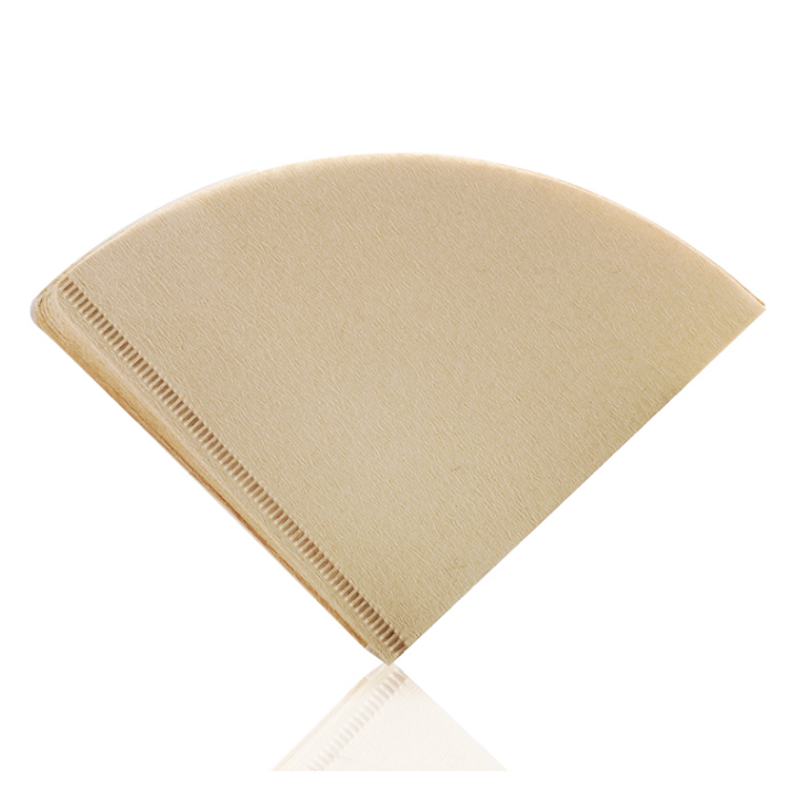 Stacked natural brown unbleached V01 cone coffee paper filters with a ribbed seam, shot from a slightly elevated angle. LAMOSE.