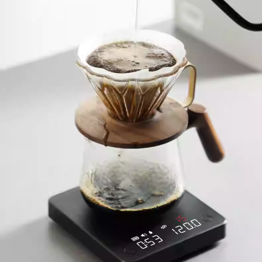 LAMOSE zeroHero Mini E-Smart Scale in black, displaying coffee pour-over timer and weight, with a glass dripper on top.